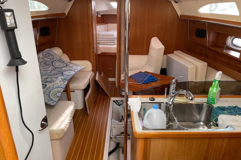 Slide: The Image of Interior of a 2014 Catalina 355 sailboat with cozy seating and kitchenette. - 27