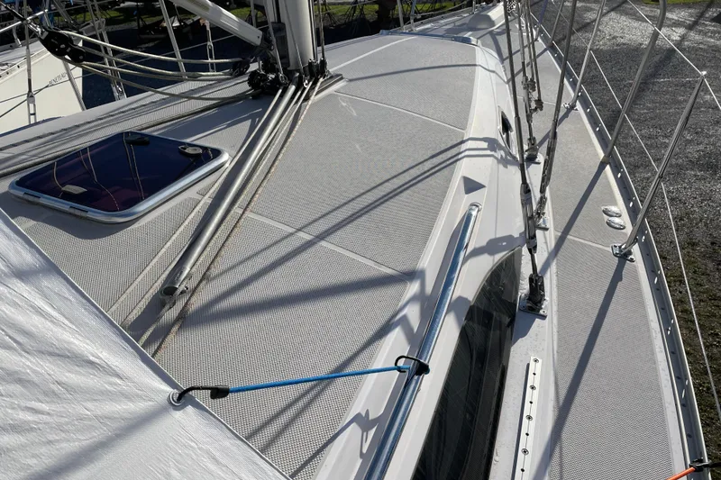 Slide: The Image of Deck view of a 2014 Catalina 355 sailboat, showcasing rigging and hatch details. - 29