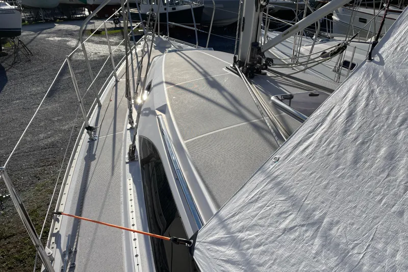 Slide: The Image of 2014 Catalina 355 sailboat deck with rigging and sunlight reflections. - 30