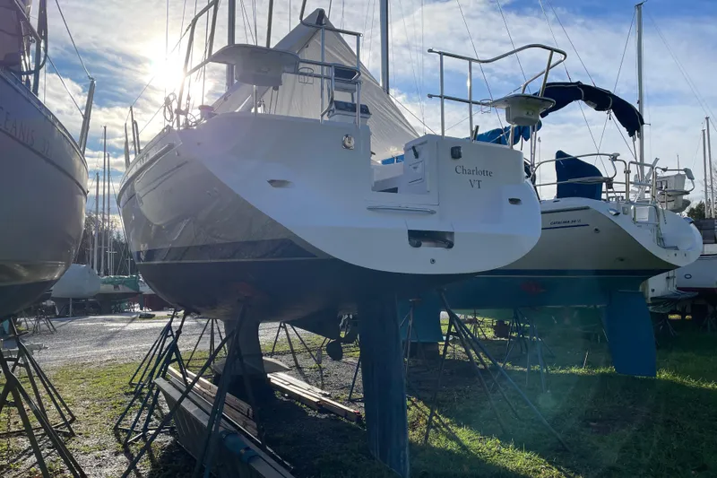 Slide: The Image of Catalina 355 sailboat from 2014 on stands, with sunlight in the background. - 31