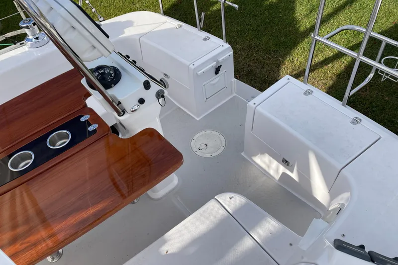 Slide: The Image of Cockpit of 2014 Catalina 355 sailboat with wooden seating and navigation instruments. - 9