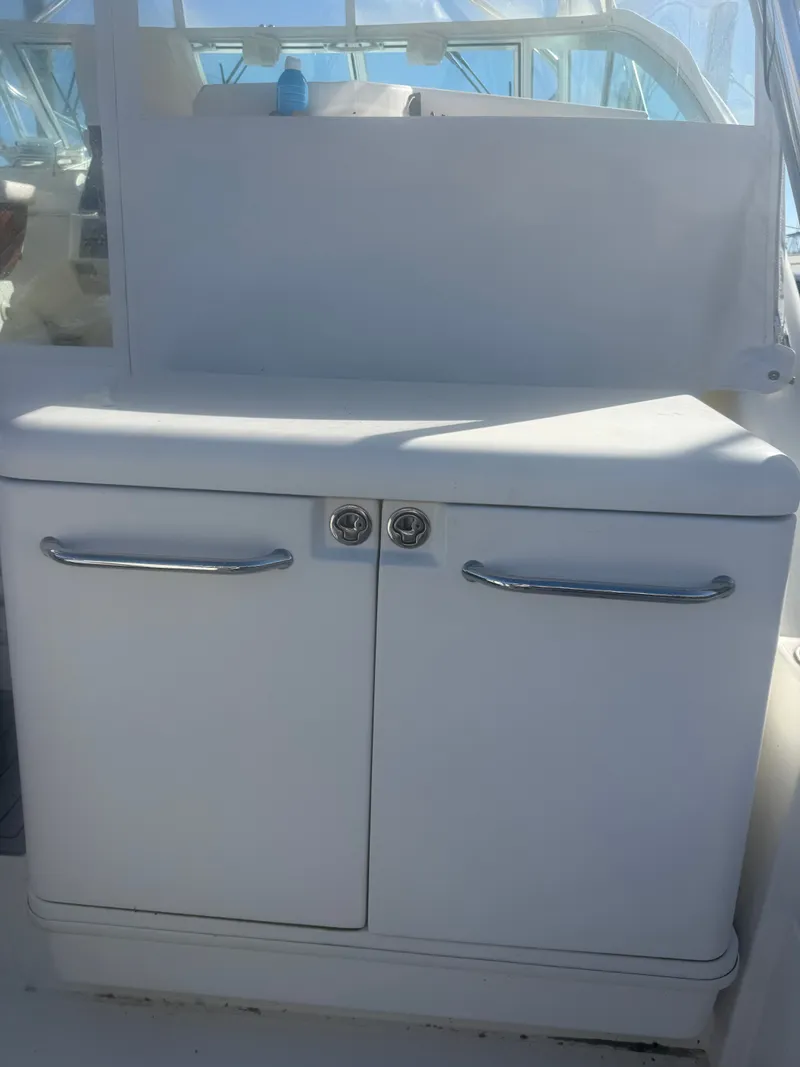 Slide: The Image of White cabinet doors on a 2008 Rampage EXPRESS boat. - 10