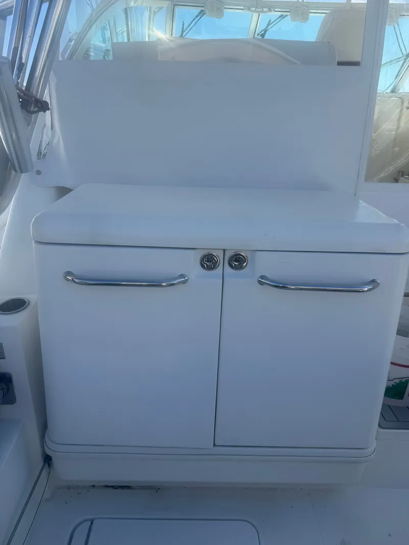 Slide: The Image of White cabinet door on a 2008 Rampage EXPRESS boat. - 11