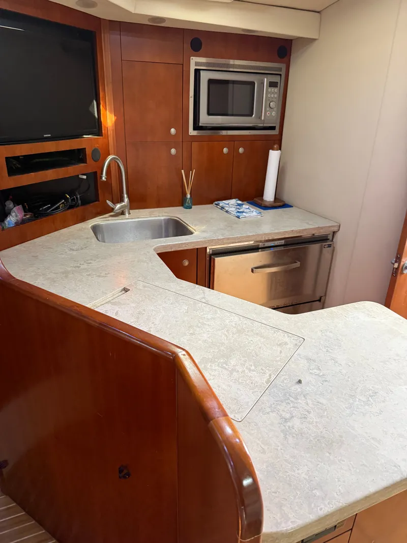 Slide: The Image of Interior of a 2008 Rampage EXPRESS yacht kitchen with microwave and sink. - 16
