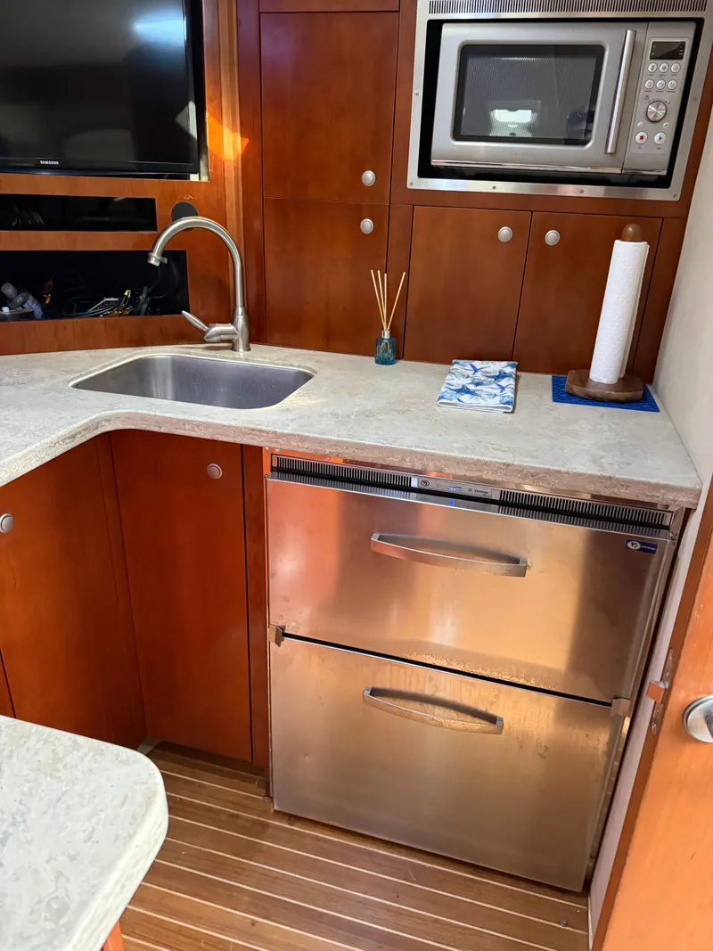 Slide: The Image of Kitchen area in a 2008 Rampage EXPRESS yacht. - 18