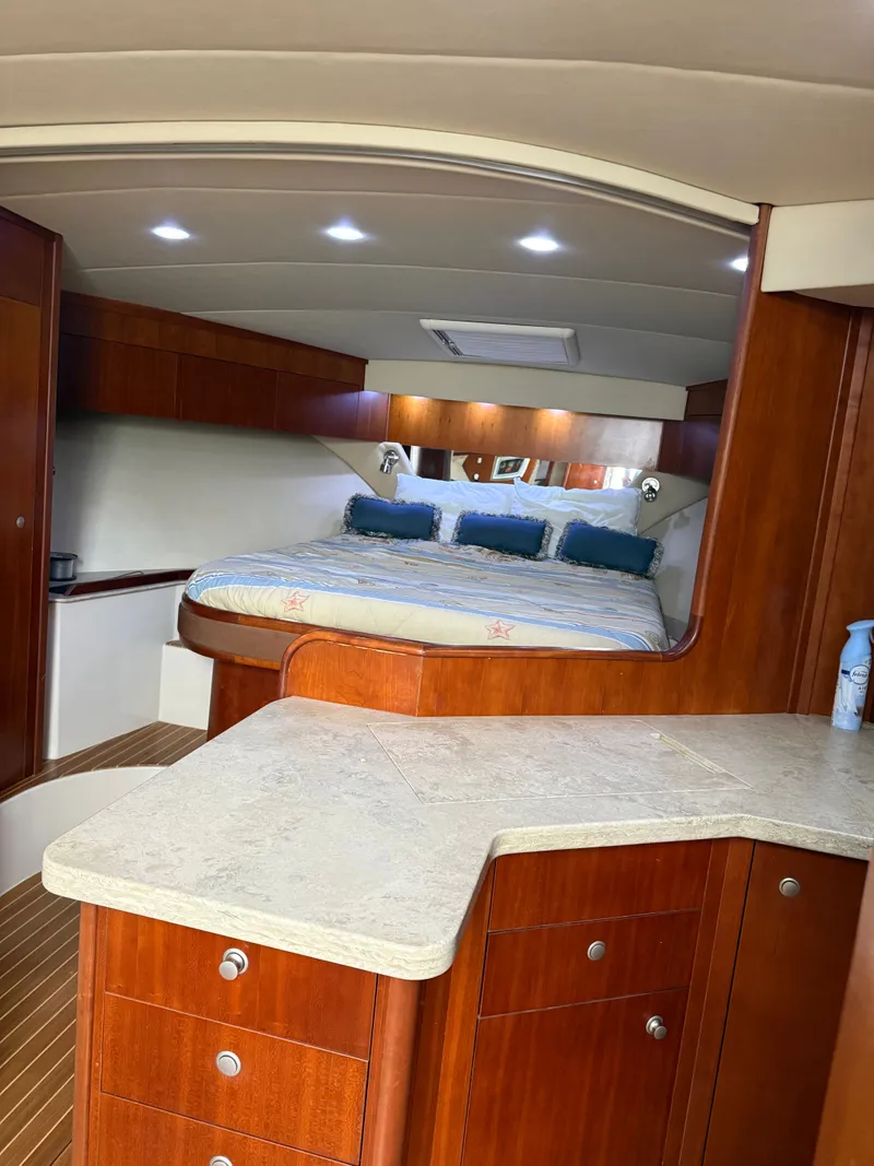 Slide: The Image of Interior of a 2008 Rampage EXPRESS yacht with wooden furnishings. - 19