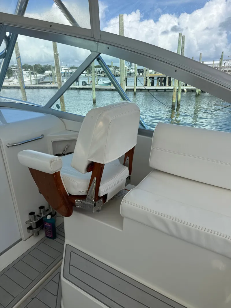 Slide: The Image of Interior of a 2008 Rampage EXPRESS boat with white seating. - 7