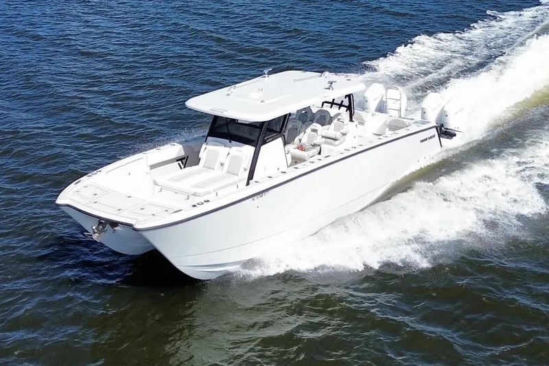 The Image of 2025 Twin Vee 400 GFX2 CC cruising on open water, showcasing sleek design and performance. - 0