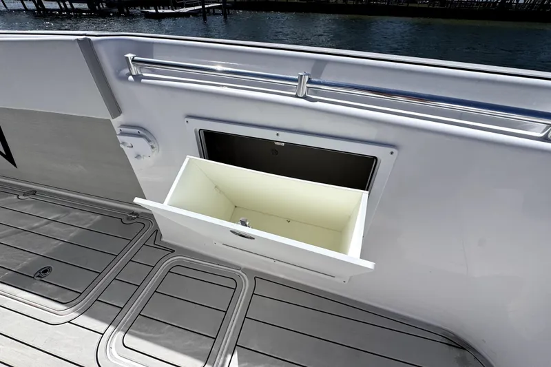 Slide: The Image of Storage compartment on 2025 Twin Vee 400 GFX2 CC boat deck, open drawer view. - 11