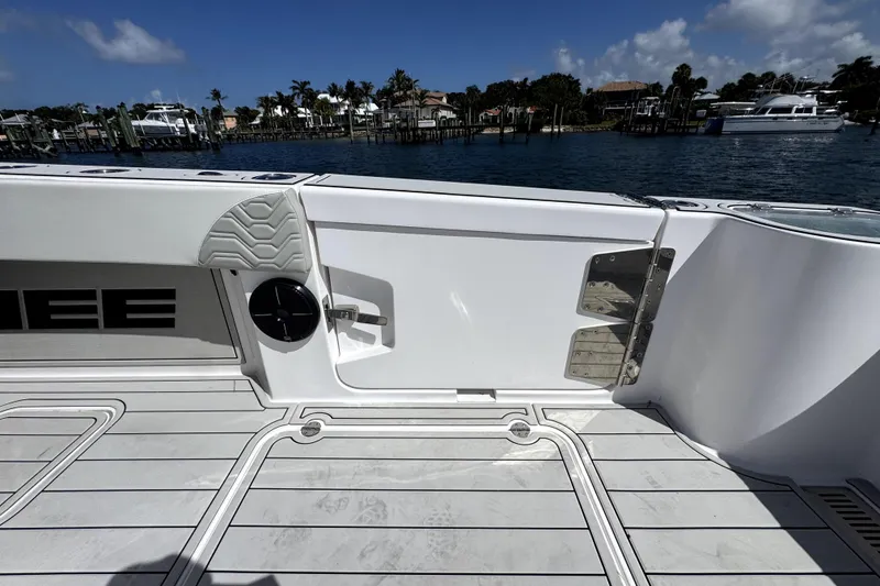 Slide: The Image of Twin Vee 400 GFX2 CC 2025 boat deck with sleek design and ocean view. - 12