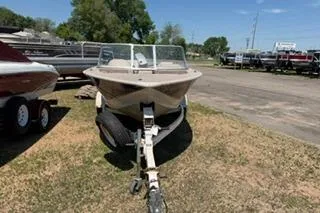 Slide: The Image of 1998 Sylvan 2000 Eliminator boat on trailer in outdoor lot. - 3
