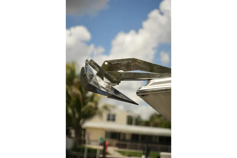 Slide: The Image of Close-up of a 2018 Regal 28 Express boat anchor against a cloudy sky. - 13