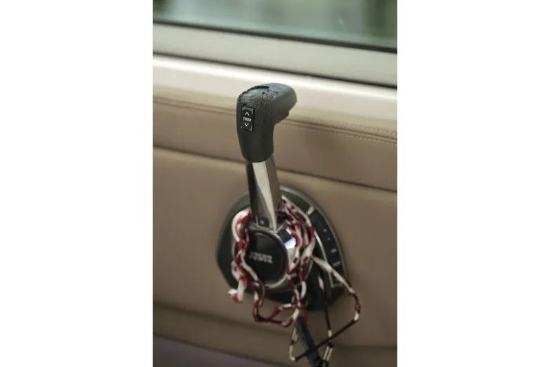 Slide: The Image of Close-up of throttle control in 2018 Regal 28 Express boat cockpit. - 15