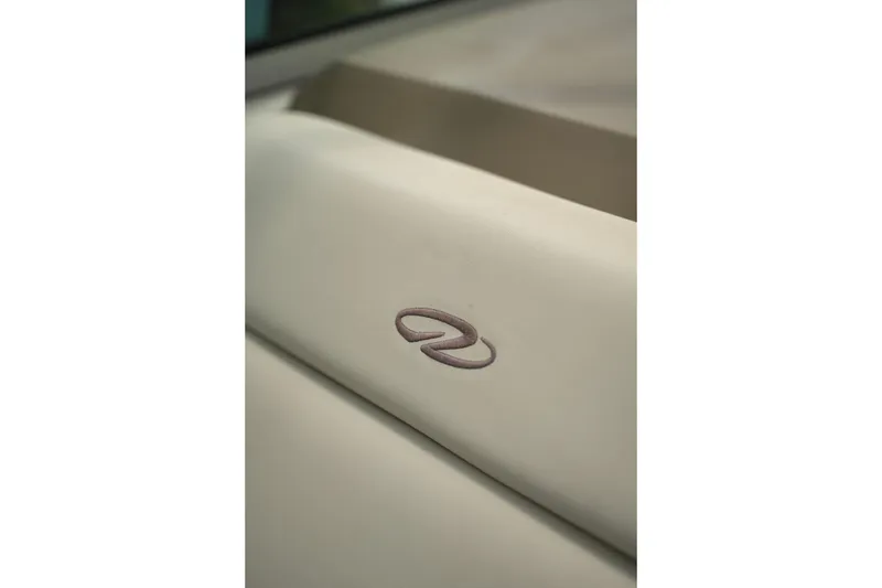 Slide: The Image of Close-up of Regal 28 Express 2018 boat seat with embroidered logo. - 17