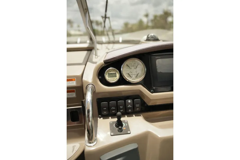 Slide: The Image of Dashboard of a 2018 Regal 28 Express boat with gauges and controls. - 19
