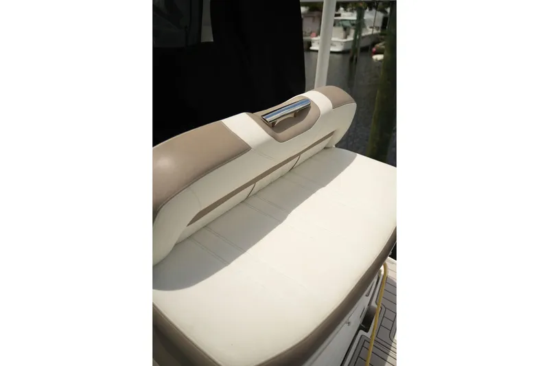 Slide: The Image of Cream and tan seating on a 2018 Regal 28 Express boat, featuring sleek design. - 24