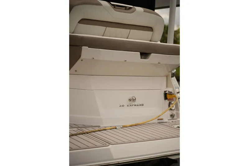 Slide: The Image of 2018 Regal 28 Express boat stern with seating and power connection. - 33