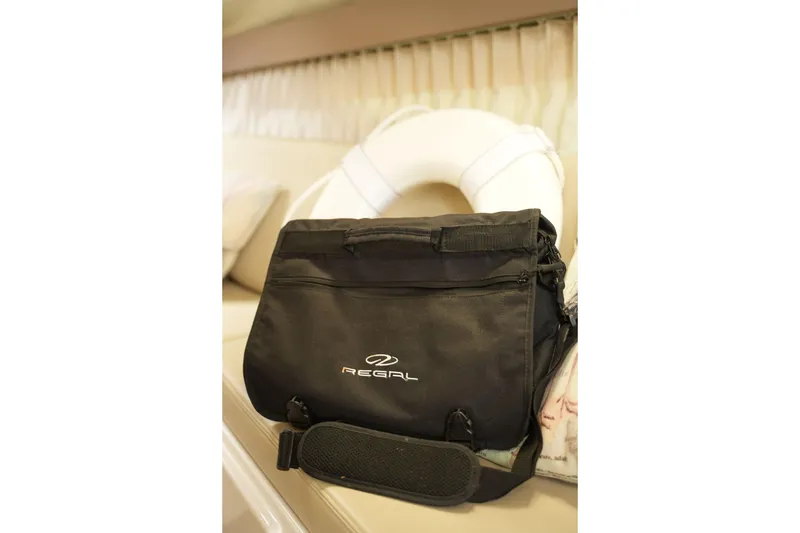 Slide: The Image of Black Regal bag on a 2018 Regal 28 Express boat interior. - 35