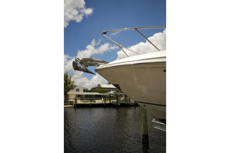 Slide: The Image of 2018 Regal 28 Express boat docked on a sunny day with blue sky. - 4