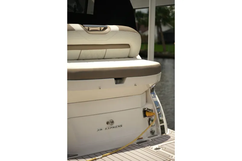Slide: The Image of 2018 Regal 28 Express boat stern with seating and dock connection. - 9