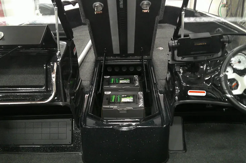 Slide: The Image of Interior of a 2026 Nitro ZV19 Sport Pro boat showing battery compartment and controls. - 7