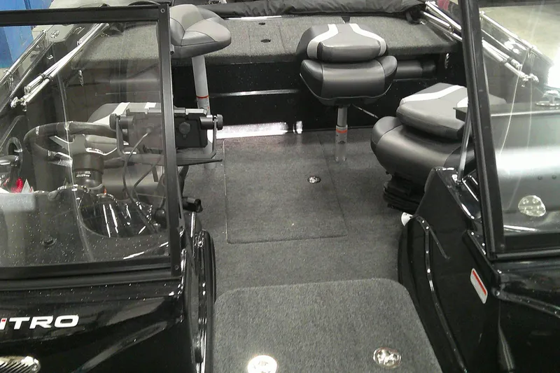 Slide: The Image of Interior of 2026 Nitro ZV19 Sport Pro boat with seating and steering console. - 8