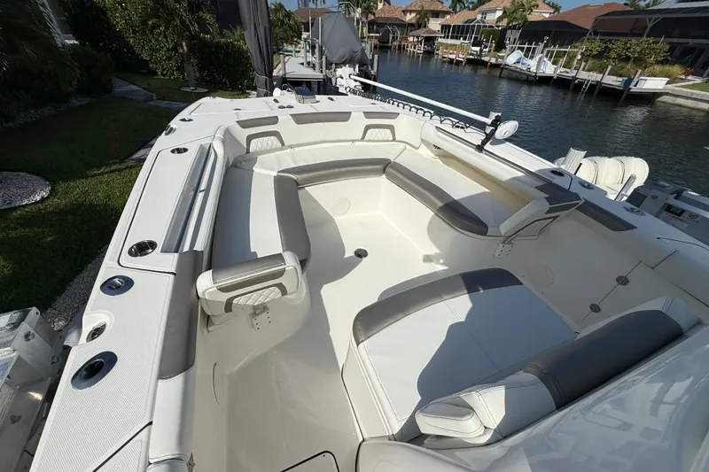 Slide: The Image of 2023 World Cat 325 CC boat interior with spacious seating and modern design. - 10