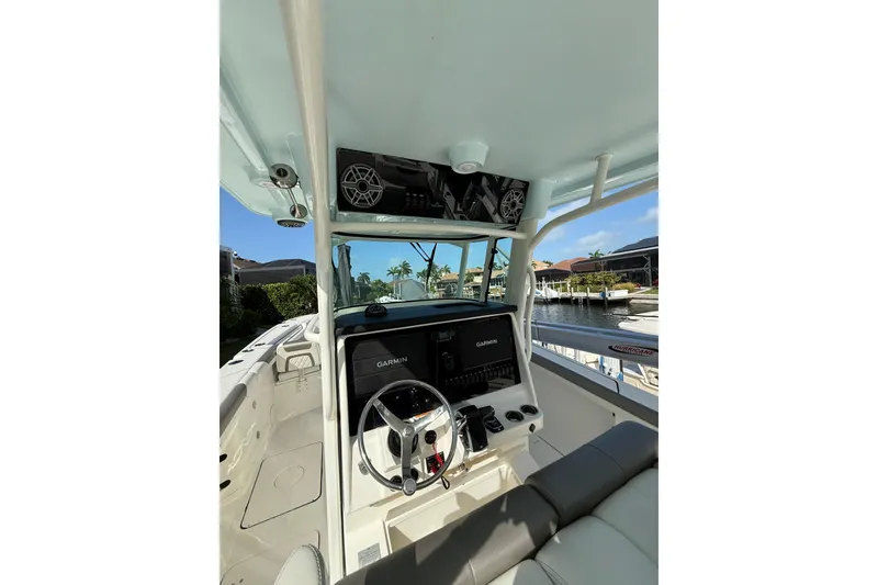Slide: The Image of Interior view of 2023 World Cat 325 CC boat with Garmin navigation system. - 13