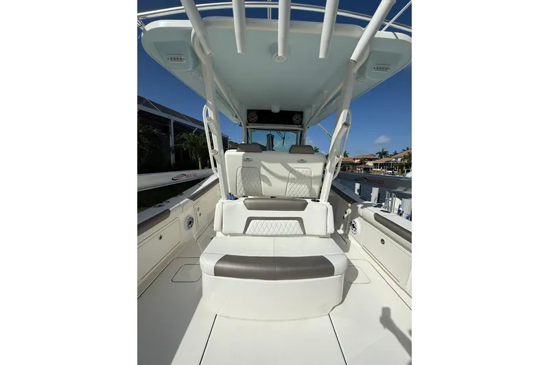 Slide: The Image of 2023 World Cat 325 CC boat interior with seating and helm station. - 14