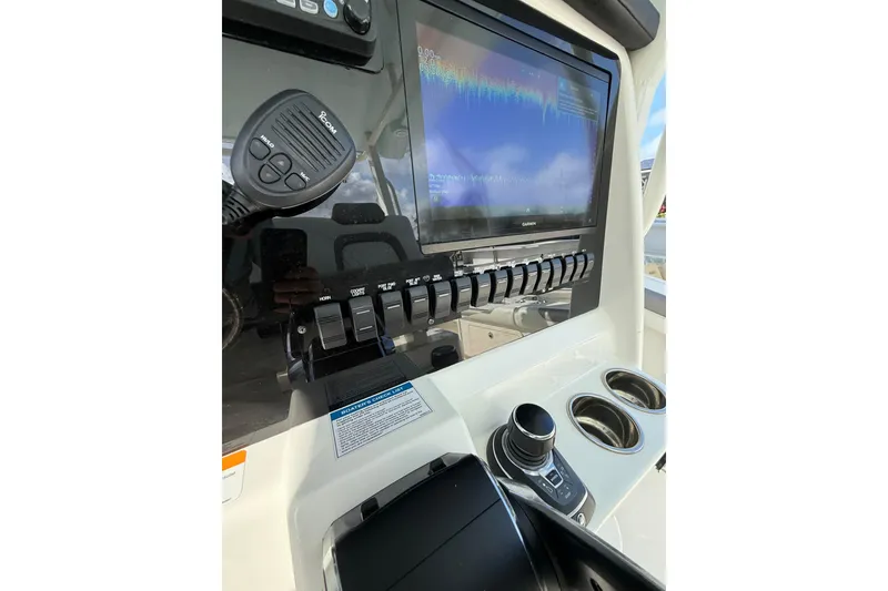Slide: The Image of 2023 World Cat 325 CC dashboard with controls and display screen. - 15