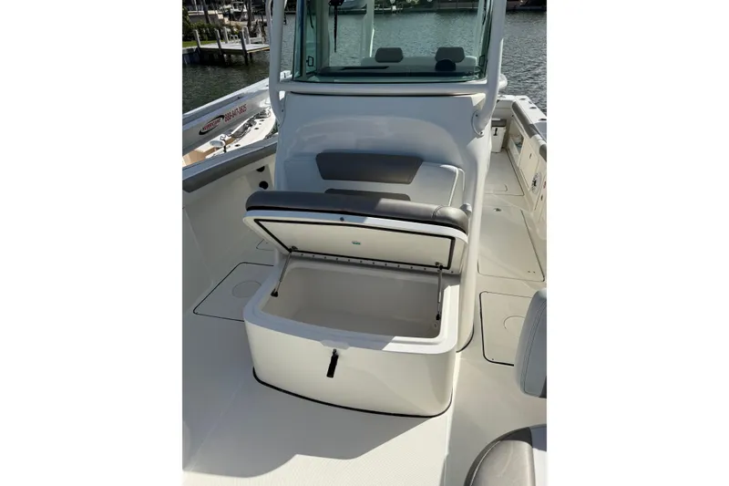 Slide: The Image of 2023 World Cat 325 CC boat interior with open storage compartment. - 21
