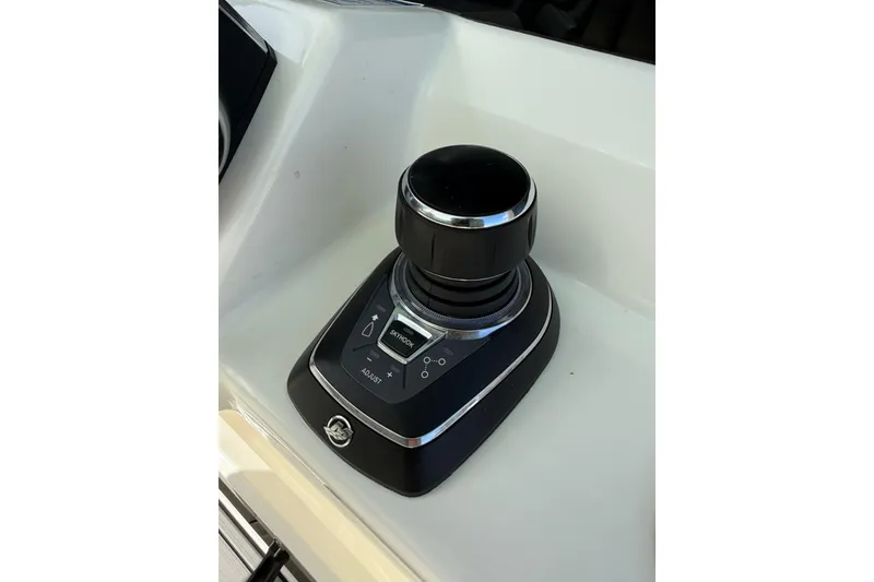 Slide: The Image of Joystick control on 2023 World Cat 325 CC boat dashboard. - 23