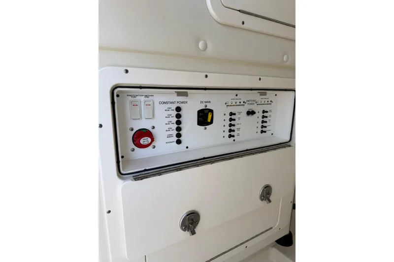 Slide: The Image of Control panel of 2023 World Cat 325 CC boat, featuring switches and power controls. - 24