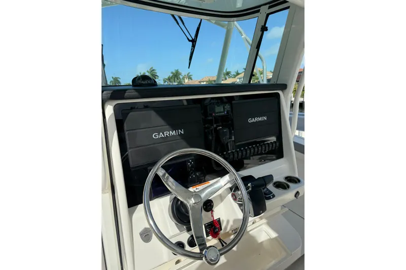 Slide: The Image of 2023 World Cat 325 CC helm with Garmin displays and steering wheel. - 29