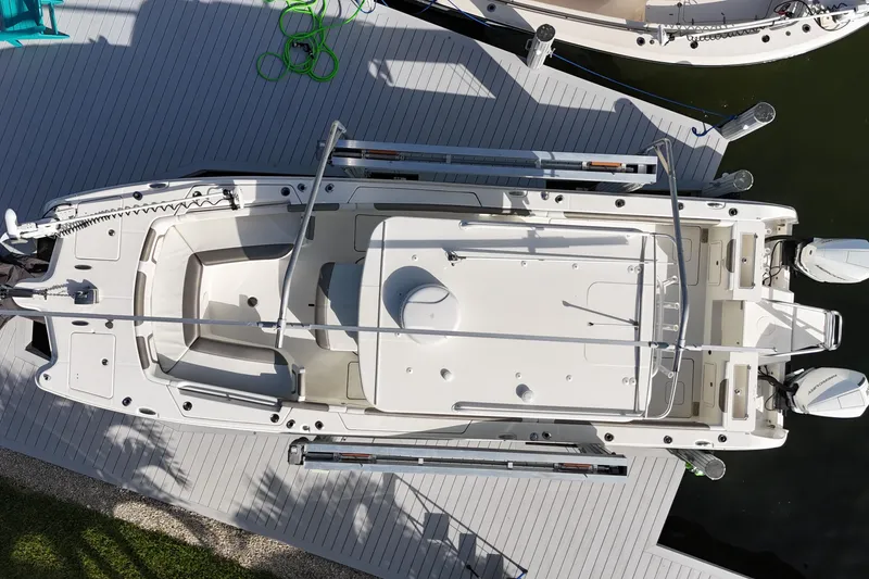 Slide: The Image of Overhead view of 2023 World Cat 325 CC boat docked on a sunny day. - 39