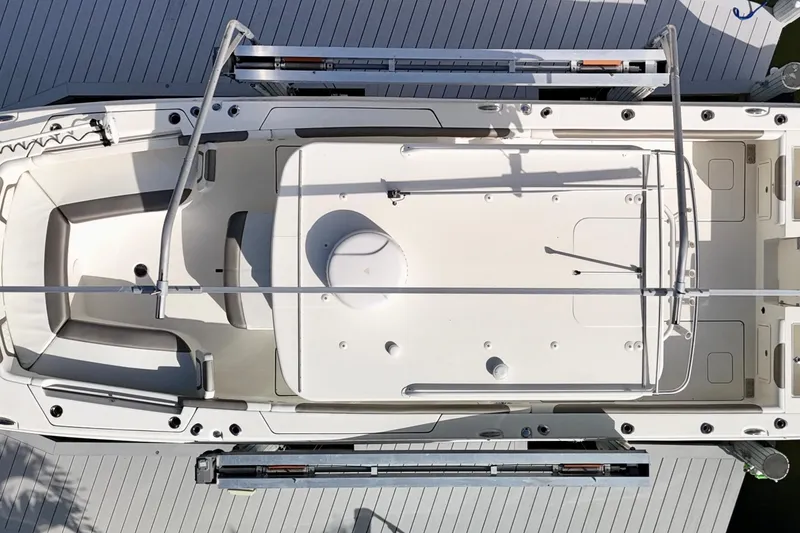 Slide: The Image of Overhead view of 2023 World Cat 325 CC boat, showcasing deck layout and seating arrangement. - 42