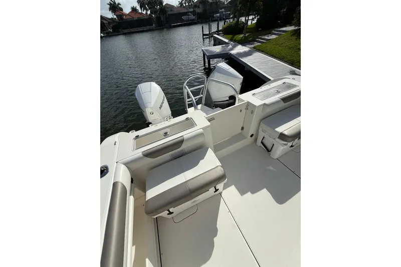 Slide: The Image of 2023 World Cat 325 CC boat interior with seating and outboard motors. - 44