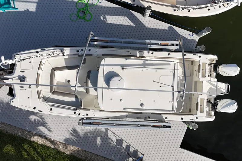Slide: The Image of Overhead view of 2023 World Cat 325 CC boat docked on water. - 47