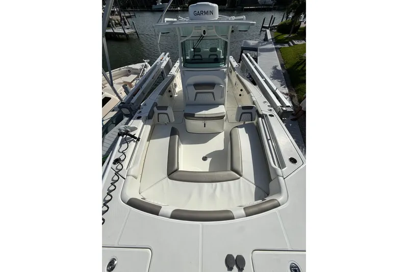 Slide: The Image of 2023 World Cat 325 CC boat interior with seating and Garmin equipment. - 9
