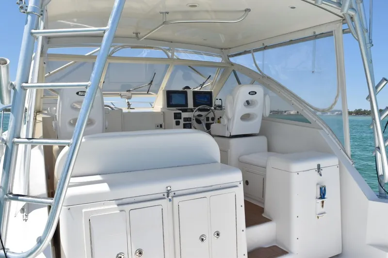 Slide: The Image of 2006 Carolina Classic 32 boat interior with helm, seating, and navigation equipment. - 12