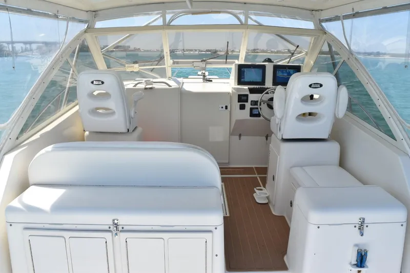 Slide: The Image of 2006 Carolina Classic 32 boat interior with helm, seating, and navigation equipment. - 13
