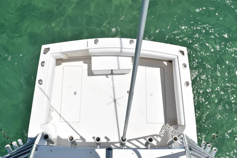 Slide: The Image of Top view of 2006 Carolina Classic 32 boat deck on turquoise water. - 14