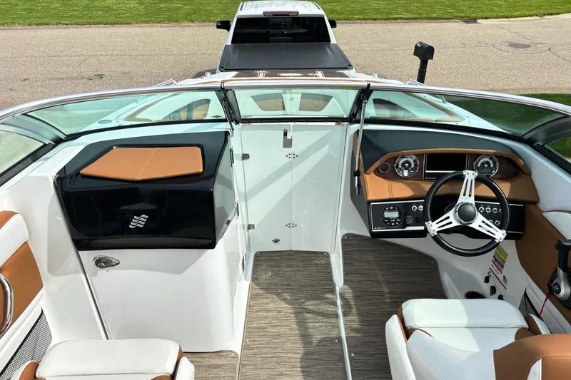 Slide: The Image of 2020 Four Winns HD220 boat interior with modern dashboard and steering wheel. - 16