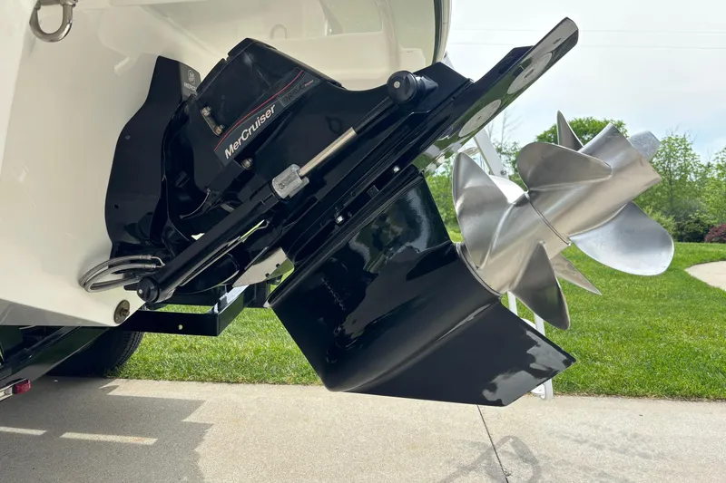 Slide: The Image of 2020 Four Winns HD220 boat with MerCruiser outdrive and stainless steel propeller. - 24