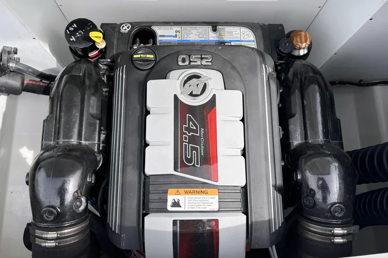 Slide: The Image of Engine compartment of a 2020 Four Winns HD220 boat, featuring a MerCruiser 4.5L engine. - 9