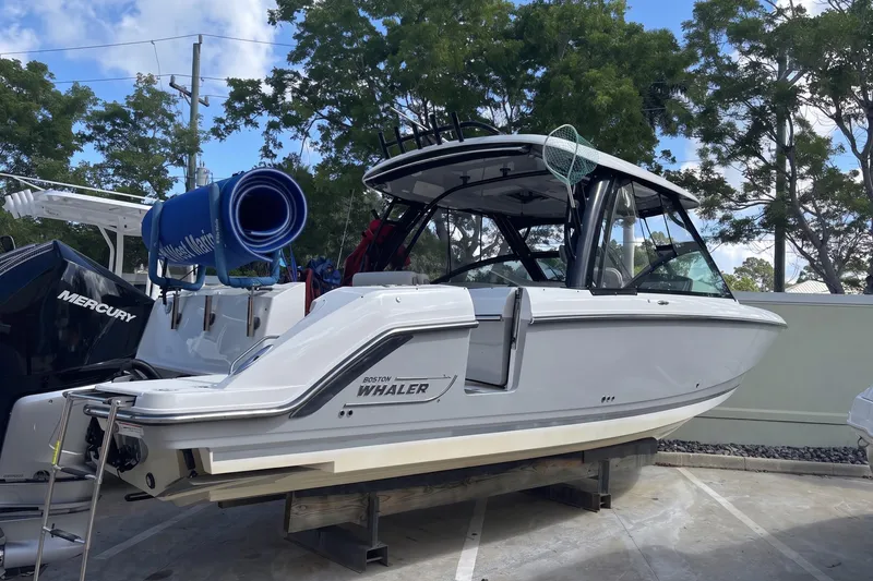 Slide: The Image of 2024 Boston Whaler 320 Vantage boat on display, featuring sleek design and modern amenities. - 2