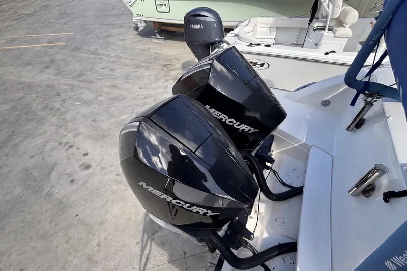 Slide: The Image of 2024 Boston Whaler 320 Vantage with dual Mercury outboard engines. - 4