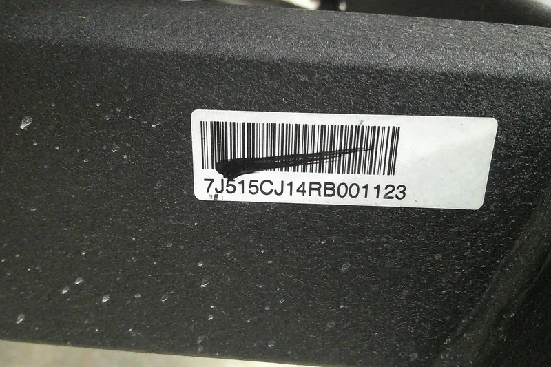 Slide: The Image of Barcode label on 2024 Tahoe T18 with serial number 7J515CJ14RB001123. - 7