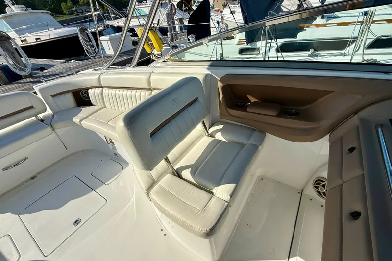 Slide: The Image of Interior of a 2007 Cobalt 323 boat with white leather seating. - 10