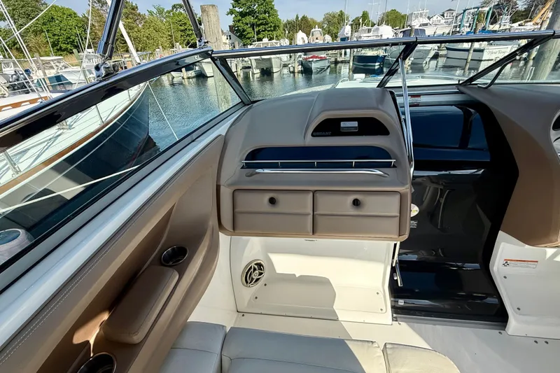 Slide: The Image of Interior view of a 2007 Cobalt 323 boat docked at a marina. - 13